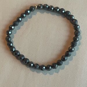 Black Beaded Bracelet with gold bead